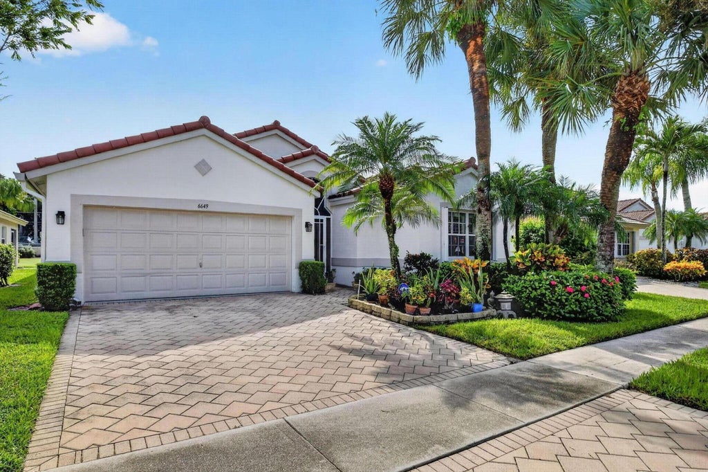 Photo of 6649 Sun River Road, Boynton Beach, FL 33437 (MLS # B26079007)