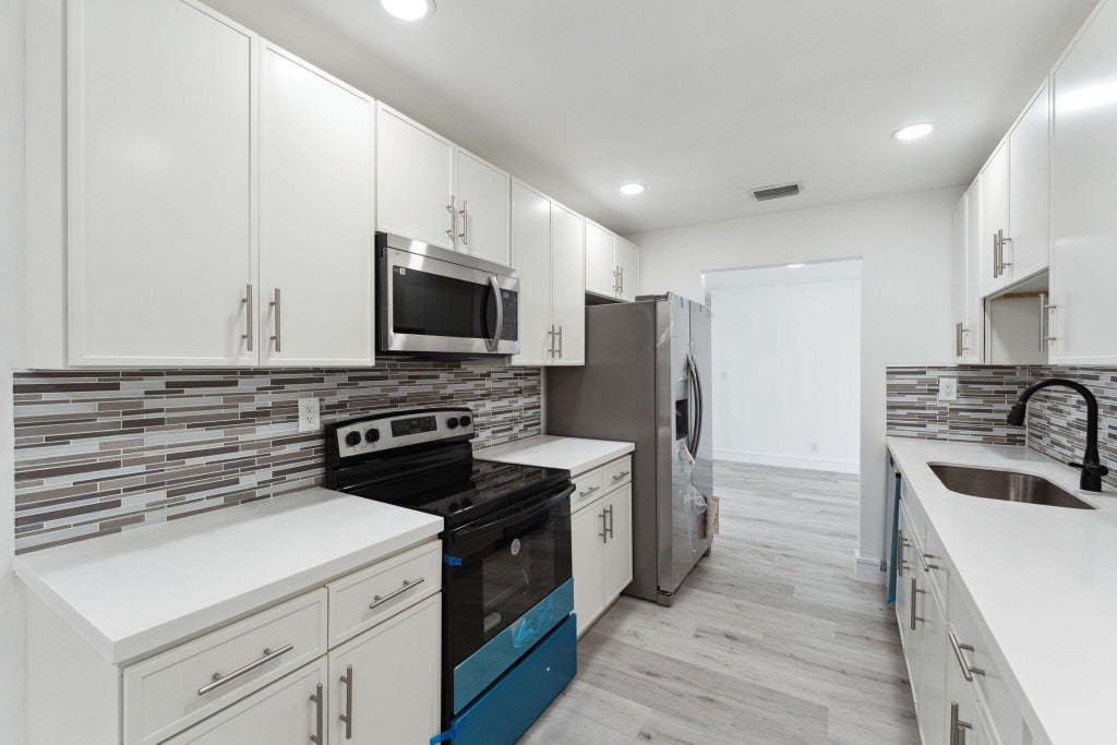 Photo of 140 NE 5th Street, Deerfield Beach, FL 33441 (MLS # R11009834)