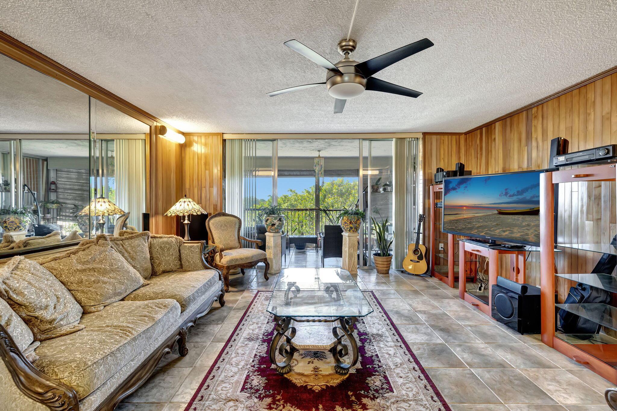 Expansive 3-bed, 2-bath condo offering 1,750 sq ft of living space with large rooms throughout, including an oversized primary bedroom that opens to a serene, enclosed balcony. Enjoy a built-in wet bar for entertaining, along with peaceful views in a quiet, gated 55+ community featuring 24-hour manned security. HOA includes cable, all channels, internet, water, insurance, and pest control. Resort-style amenities include a BBQ area, gazebo, tennis courts, basketball courts, racquetball courts, billiards, a fitness room, a library, and a grand ballroom for events. Must be 55+, have 710+ credit, $45K income. Can rent after 1 year. Close to shops, dining, and major highways. The community is beautifully maintained. Seller is motivated--bring all offers!