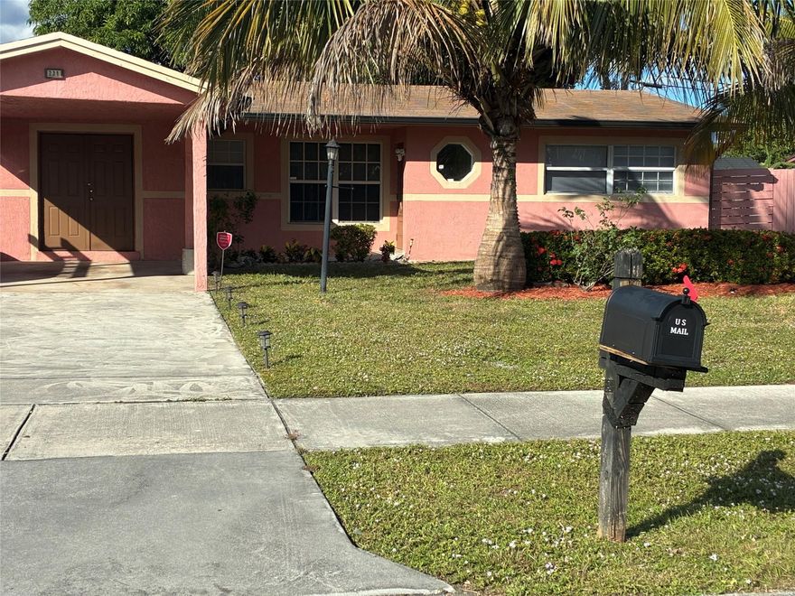 Welcome to this beautiful single-family home, perfectly situated in a lovely neighborhood. This spacious property features four cozy bedrooms and two modern bathrooms, offering ample space for comfortable living. Enjoy the many upgrades throughout, including central air conditioning, ceiling fans, and a fenced yard—perfect for pets and outdoor gatherings. The property also boasts mature trees and fruit trees that provide lovely shade and a touch of nature. Plus, the covered carport and storage shed add extra convenience for your daily needs. Located just a short 10-minute drive from the beach, and close to fantastic restaurants, major highways, and excellent shopping, this home offers the perfect blend of comfort and convenience.