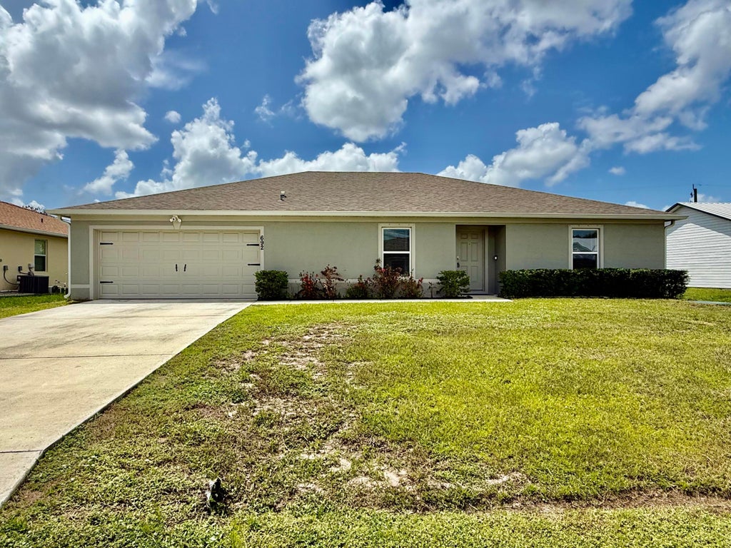 Photo of 692 SW Hamberland Avenue, Port Saint Lucie, FL 34953 (MLS # B26064848)