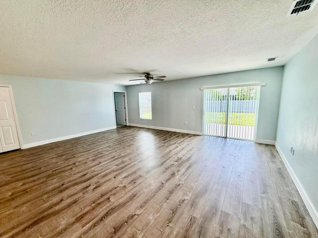 Photo of 692 SW Hamberland Avenue, Port Saint Lucie, FL 34953 (MLS # B26064848)