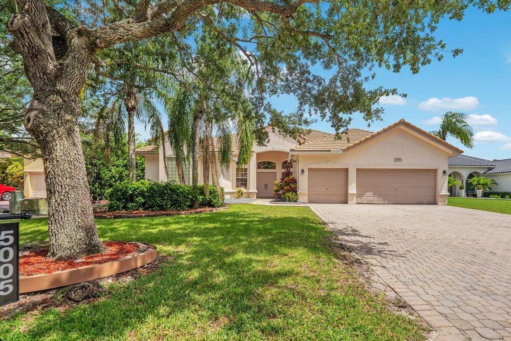 Photo of 5005 NW 57th Terrace, Coral Springs, FL 33067 (MLS # B26040046)