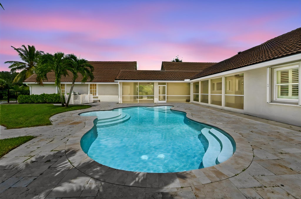 Photo of 5703 Lago Del Sol Drive, Lake Worth, FL 33449 (MLS # B26075409)