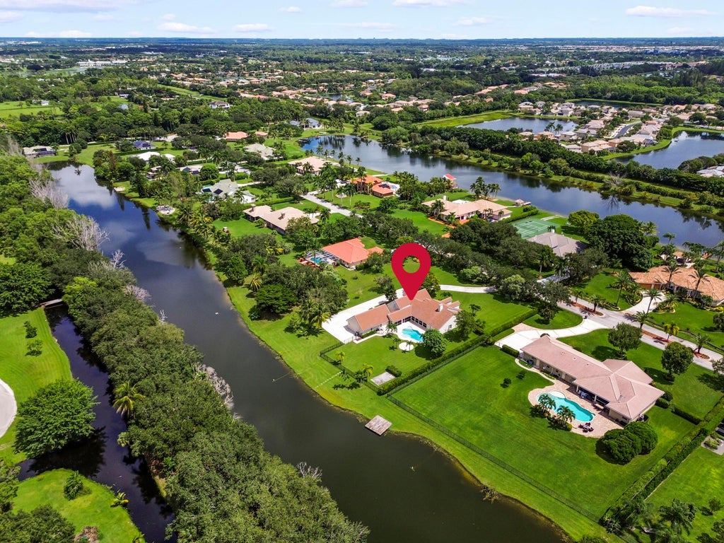 Photo of 5703 Lago Del Sol Drive, Lake Worth, FL 33449 (MLS # B26075409)