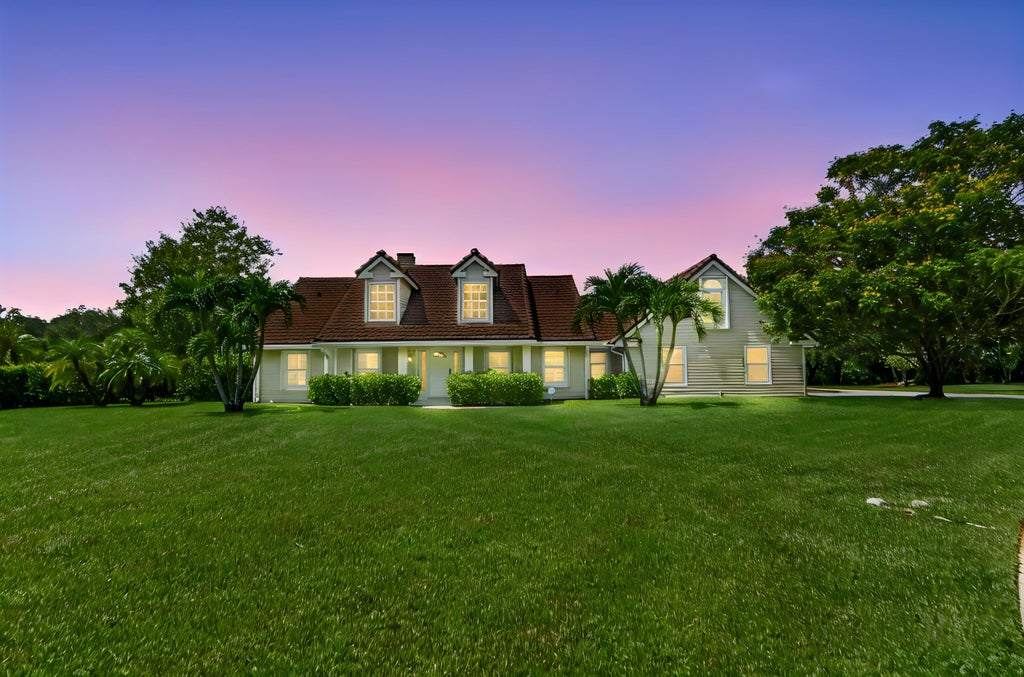 Photo of 5703 Lago Del Sol Drive, Lake Worth, FL 33449 (MLS # B26075409)
