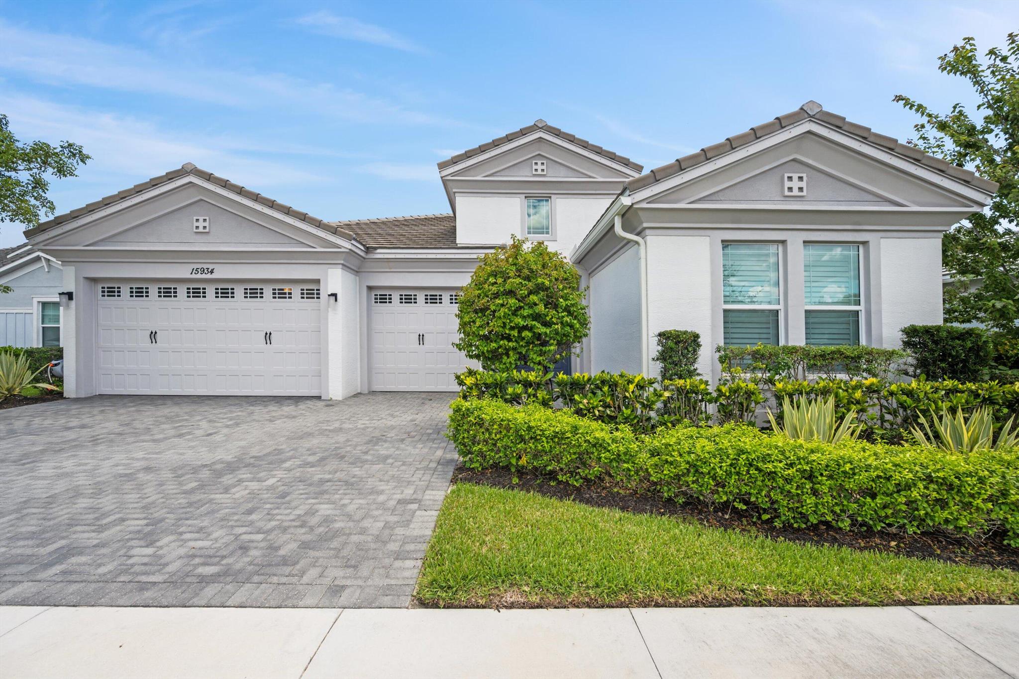 Welcome to this beautifully upgraded Sanderling model in the highly desirable Hammocks community of Westlake, FL. This 4-bedroom plus den, 4-bathroom lakefront home with a 3-car garage offers 2,951 square feet of living space and is filled with luxurious details and natural light throughout