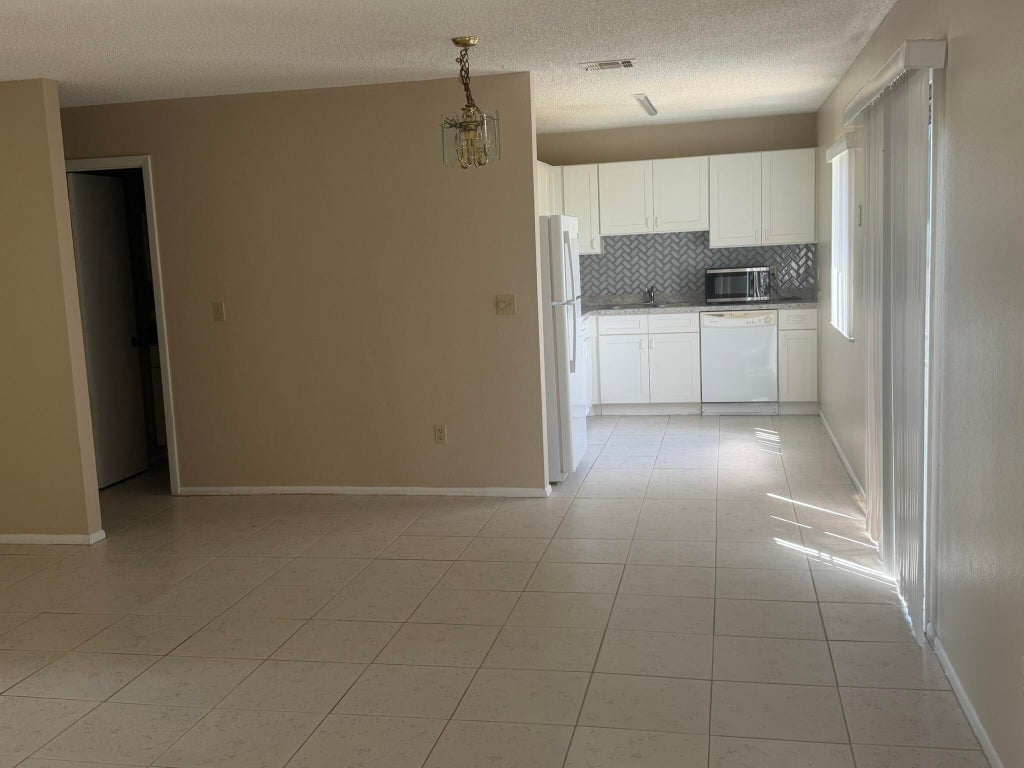Photo of 1131 SE Parrish Court, Port Saint Lucie, FL 34952 (MLS # B26028527)