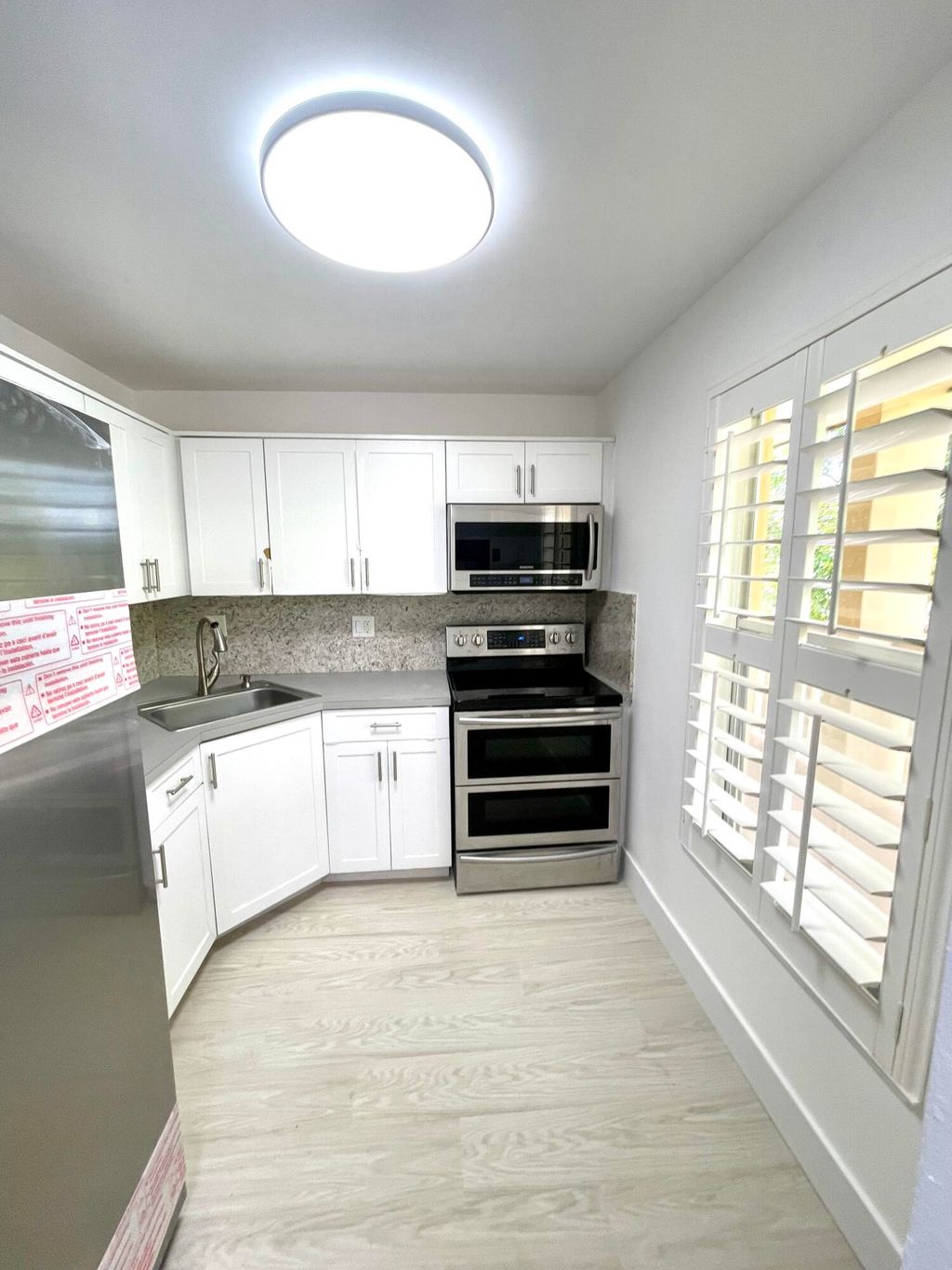 Photo of 5980 NW 64th Avenue #305, Tamarac, FL 33319 (MLS # B26026900)