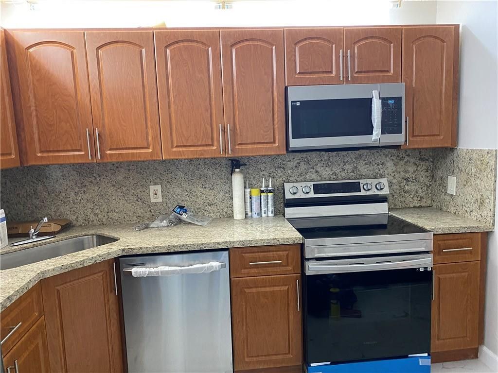 Photo of 11615 NW 28th Street #4, Coral Springs, FL 33065 (MLS # B26023532)