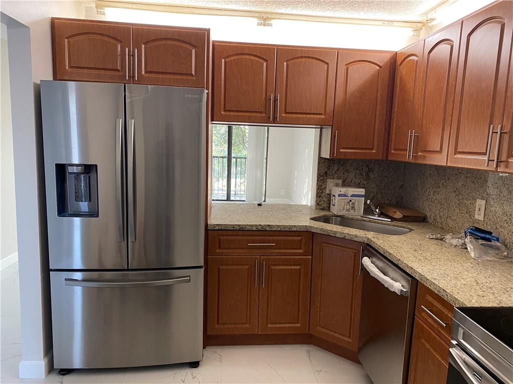 Photo of 11615 NW 28th Street #4, Coral Springs, FL 33065 (MLS # B26023532)