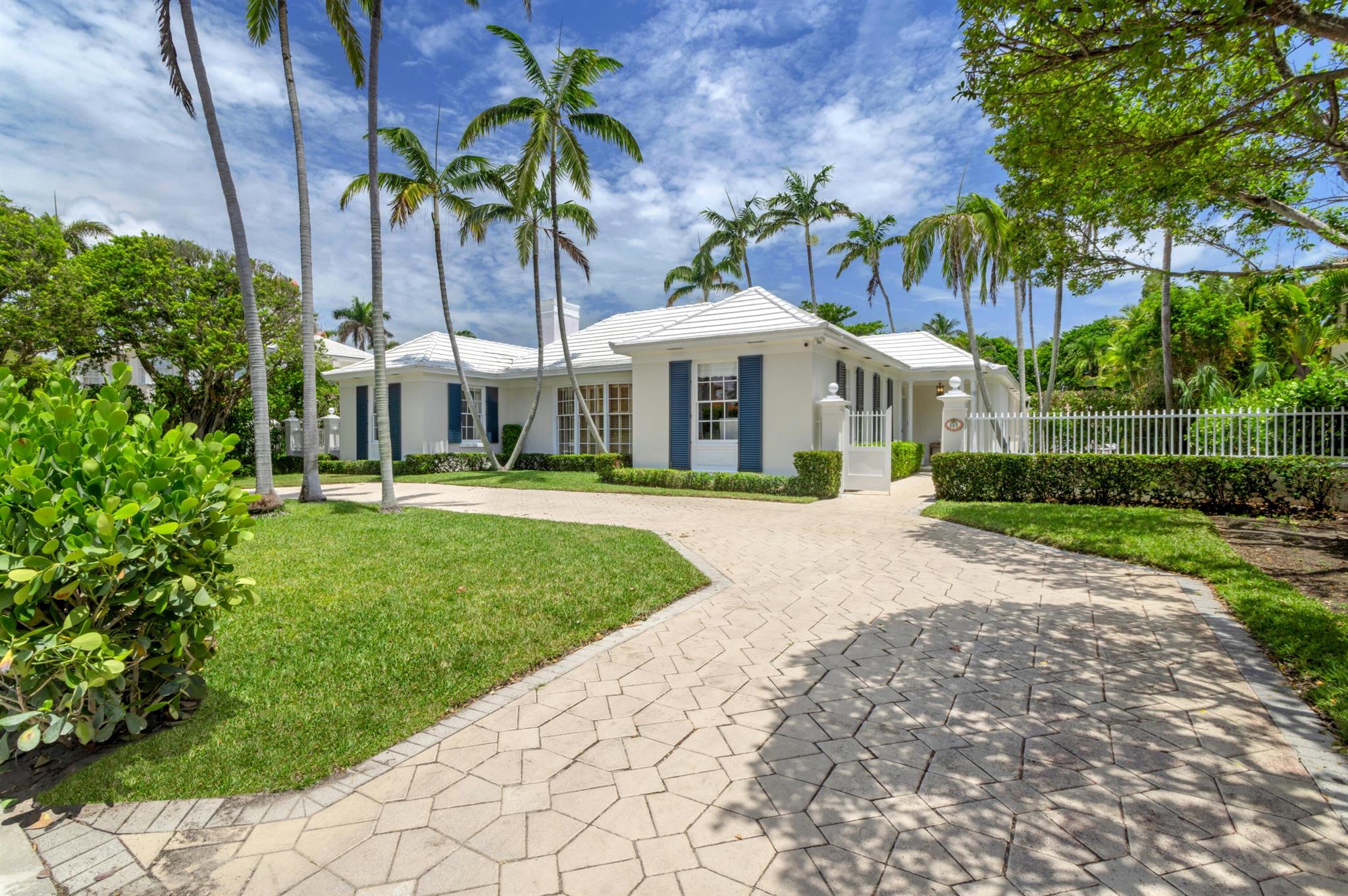 Welcome to a true gem in the heart of Palm Beach, this impeccably designed Bermuda residence by Marion Sims Wyeth is nestled on a rare, oversized 23,958+/- square foot parcel just steps from the ocean and Intracoastal. Set on a distinguished 100 x 239 foot lot with the added advantage of a rear service road on coveted Vita Serena, this elegant home offers both grandeur and privacy in one of the island's most desirable enclaves, the estate section. Encompassing 5,276+/- total square feet, the residence exudes timeless sophistication with luminous interiors, soaring ceilings, rich wood flooring, and beautifully proportioned rooms throughout.