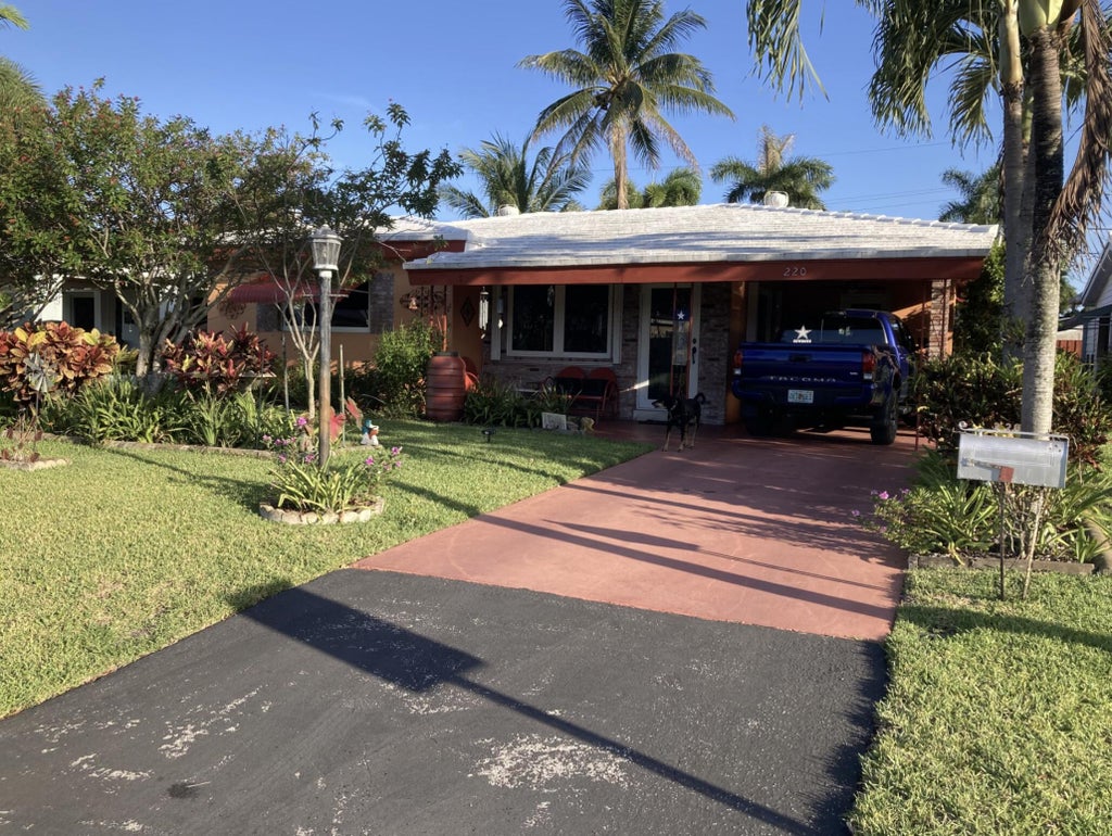 Photo of 220 NW 48th Street, Oakland Park, FL 33309 (MLS # B26046958)