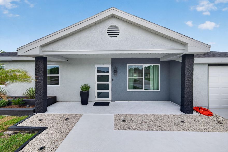 Welcome to this beautifully updated canal-front home in the heart of Port St. Lucie! This charming 3-bedroom, 2-bath residence offers approximately 1,320 square feet of comfortable living space with modern upgrades throughout. Features include updated flooring, a renovated kitchen with newer appliances, bright open living areas, and a functional layout designed for everyday comfort and entertaining. Enjoy peaceful water views from the spacious backyard with plenty of room to relax or host gatherings. Additional highlights include a 1-car garage, updated major systems, and a desirable location close to shopping, dining, schools, parks, golf courses, and major highways. Move-in ready and perfect as a primary home, seasonal retreat, or investment opportunity.