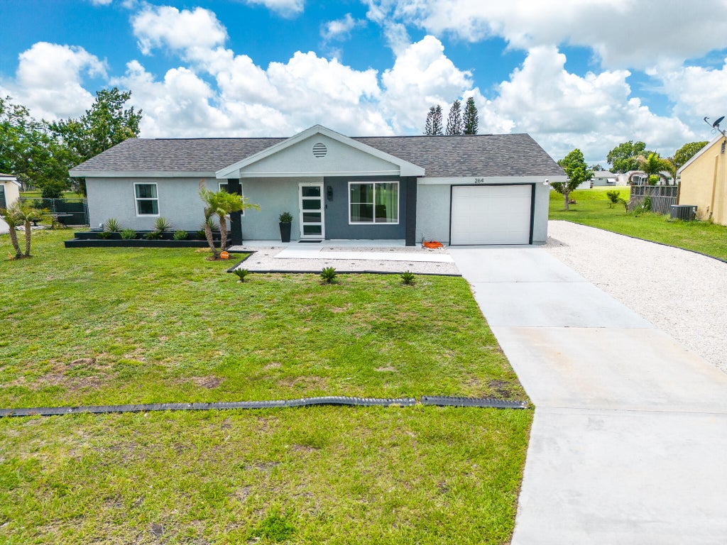 Photo of 264 SW Cherryhill Road, Port Saint Lucie, FL 34953 (MLS # B26031168)