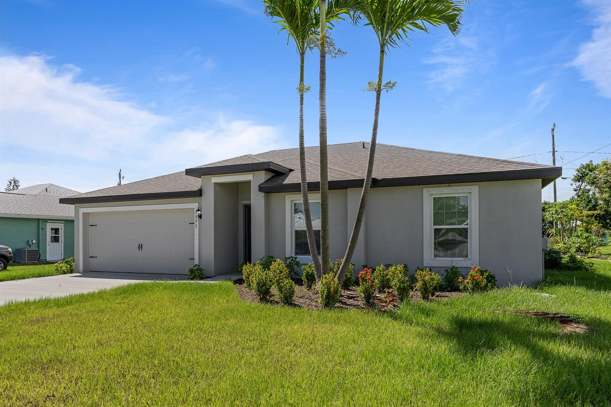 Be the first to LIVE in this brand-new (never lived in), 3-bedroom, 2-bathroom home! Enjoy a spacious backyard, parking for up to 6 cars in addition to a garage. This kitchen offers granite countertops, an eat-in bar, and a split bedroom floor plan. Located minutes from parks with splash pads, playgrounds, riverfront activities, boat ramps, kayak launches, picnic areas, fishing, and trails. Just 15 minutes to Jensen Beach and 20 minutes to downtown Stuart for waterfront dining and entertainment.