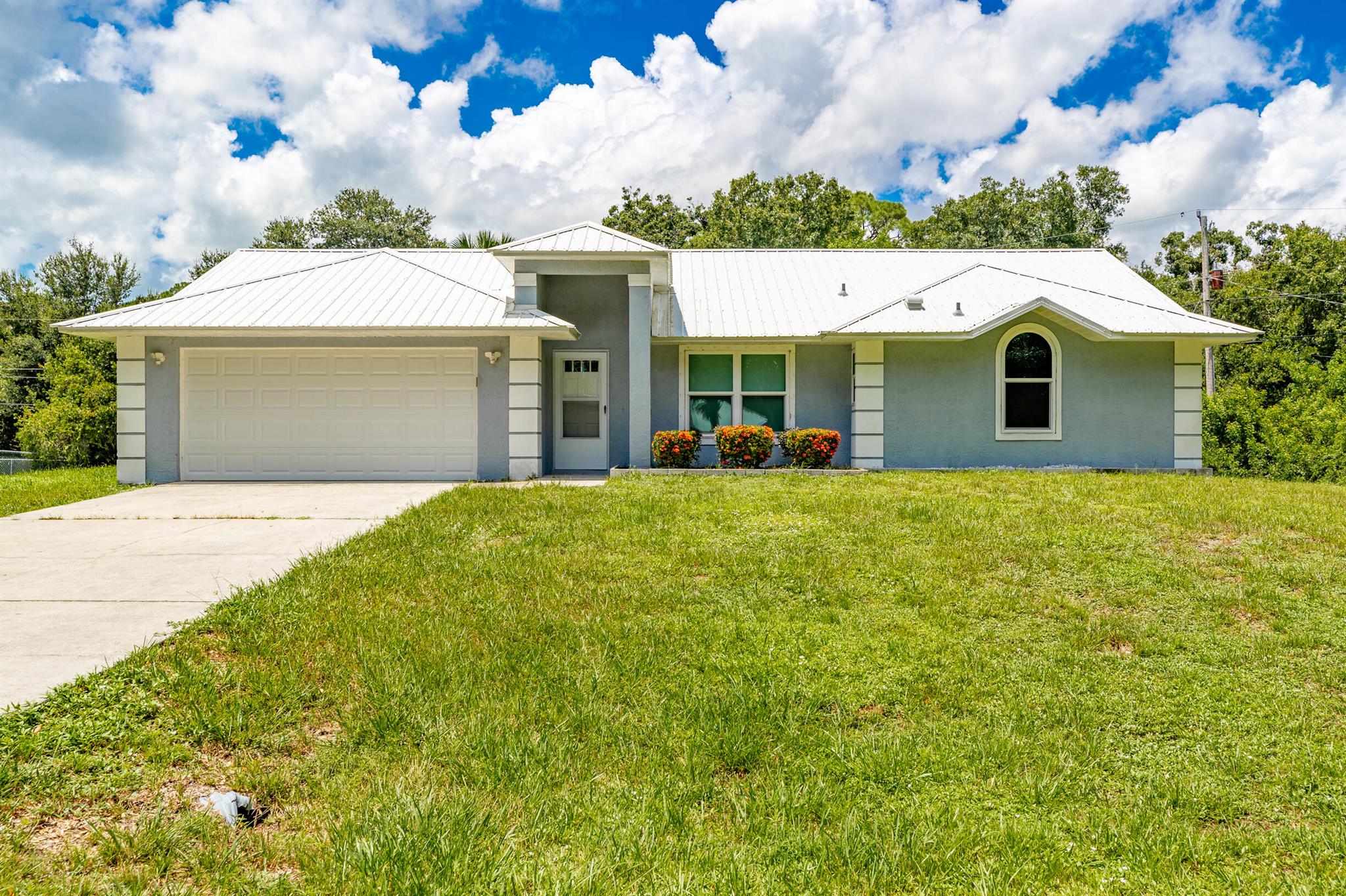 Welcome to Whippoorwill Estates, a non-HOA paved road community of only 27 residences. Bring all your toys with peace of mind on this .43 Acre lot with a fenced in yard. This open floorplan is bright, airy and welcomes you with vaulted ceilings. Featuring an extensive list of upgrades including freshly painted interior, metal roof, vinyl plank flooring, impact glass windows, new hurricane rated garage door, updated kitchen w/quartz counters, updated baths, newer AC & water heater plus updated light fixtures and new drain field. Only things left are your finishing touch's!Don't miss this beauty