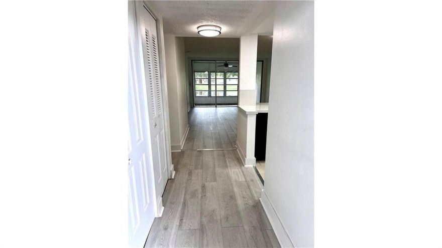 This stunning first-floor 2 bed/2 bath home offers the perfect blend of elegance and comfort. Completely upgraded with beautiful flooring, the open layout fills with natural light and flows seamlessly to your private patio overlooking a tranquil lake, ideal for relaxing or entertaining. Located in Bermuda Club, a vibrant 55+ community, residents enjoy resort-style amenities in a peaceful setting. Association requires income verification and a minimum 675 credit score.