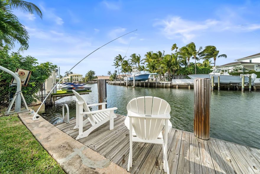 A rare waterfront opportunity in Ocean Ridge, offering effortless coastal living at an exceptional value. Welcome to 49 River Drive, a classic Henry Harding residence thoughtfully refreshed and set on an expansive .3-acre lot. This four-bedroom home blends timeless character with contemporary updates, including a beautifully redesigned kitchen.Outdoors, the property truly shines. Enjoy a 40-foot dock with no fixed bridges, a two-car garage, and generous space to relax or entertain. Deeded beach access is just moments away, allowing you to enjoy both the Intracoastal and the ocean with ease.Tucked into the intimate seaside town of Ocean Ridge, this home offers a tranquil lifestyle ideally positioned between