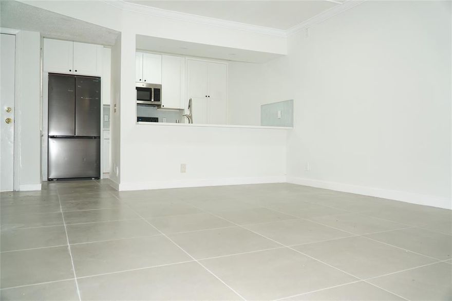 Step into this beautifully updated 3-bed, 2-bath first-floor condo, offering modern finishes and a bright, welcoming feel. The renovated kitchen boasts stainless steel appliances, complemented by sleek tile flooring and freshly painted interiors. Relax with your morning coffee or unwind at sunset in your peaceful private outdoor area. **No rental restrictions own great for investment or end user**