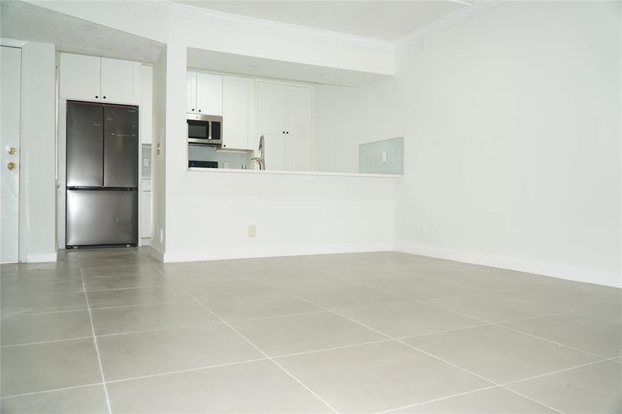 Step into this beautifully updated 3-bed, 2-bath first-floor condo, offering modern finishes and a bright, welcoming feel. The renovated kitchen boasts stainless steel appliances, complemented by sleek tile flooring and freshly painted interiors. Relax with your morning coffee or unwind at sunset in your peaceful private outdoor area. **No rental restrictions own great for investment or end user**