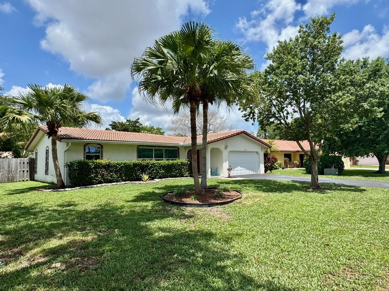 This 3 bedroom, 2 bathroom pool home in Coral Springs delivers the lifestyle you’ve been waiting for! Large format porcelain tile in all main living spaces with porcelain wood plank tile in bedrooms. The kitchen was updated with solid wood cabinets, granite countertops, and glass tile backsplash. Both bathrooms were updated as well with solid wood cabinets and quartz countertops. The home has impact glass windows, sliding doors, garage door, side garage and cabana door (Front door is not impact rated). The saltwater pool was redone in 2018 with Diamond Brite finish, new pump, LED color changing light, and travertine pool deck all set in a fully fenced yard with a covered patio. A/C, Inside Panel, Water Heater all updated as well since 2018. No HOA, quiet street, and close to parks!