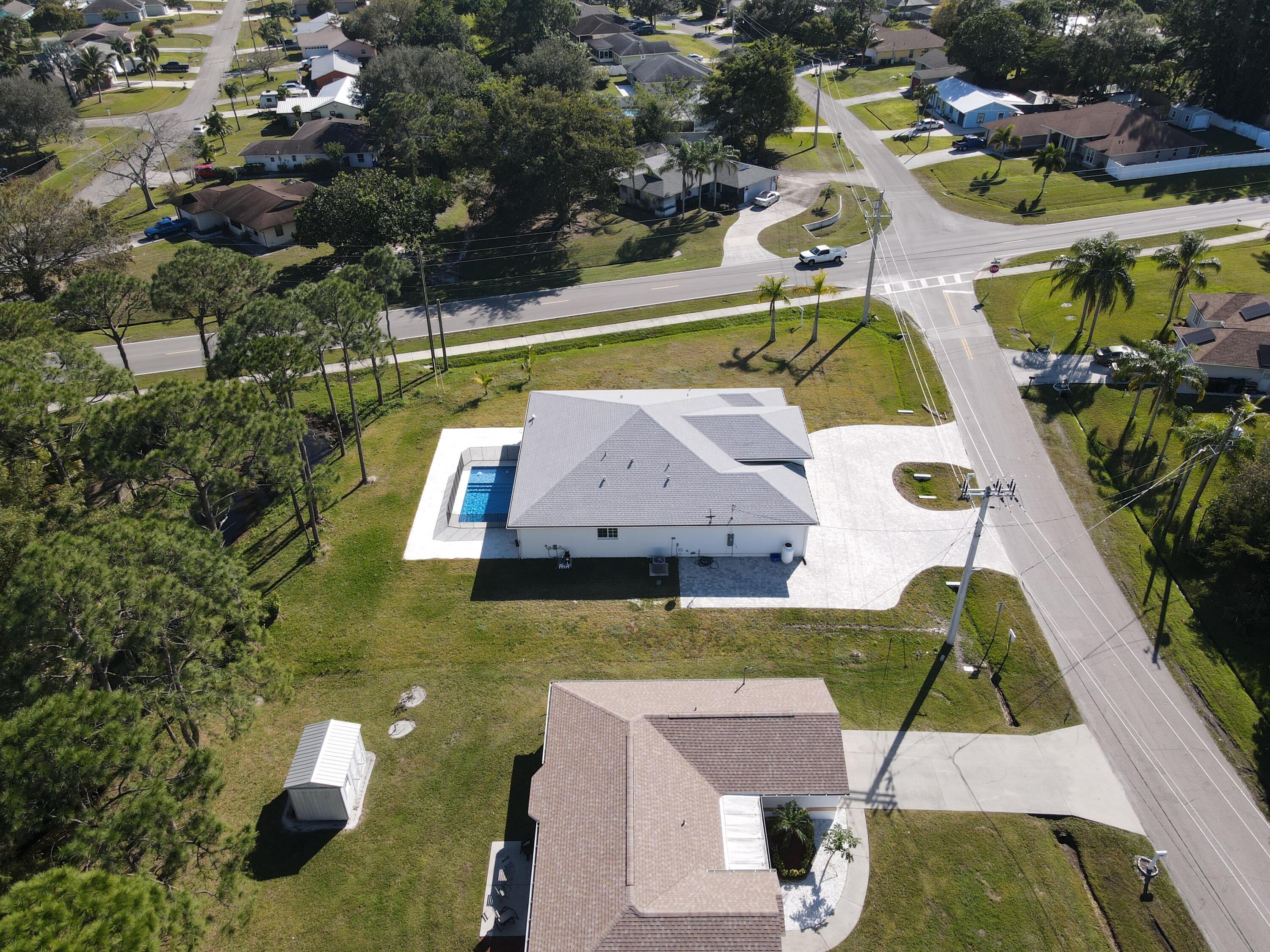 Discover Burlington, a stunning 4-bedroom, 3-bath single-level home on a spacious 16,250 sq ft corner lot. Featuring a modern open layout, high-end finishes, and a sparkling in-ground pool, this home offers the perfect blend of style and comfort. Located just 3 minutes from the Florida Turnpike, enjoy easy access to shops, dining, and more -- all while enjoying a peaceful, private setting. Schedule your showing today! Virtual tour available upon request.