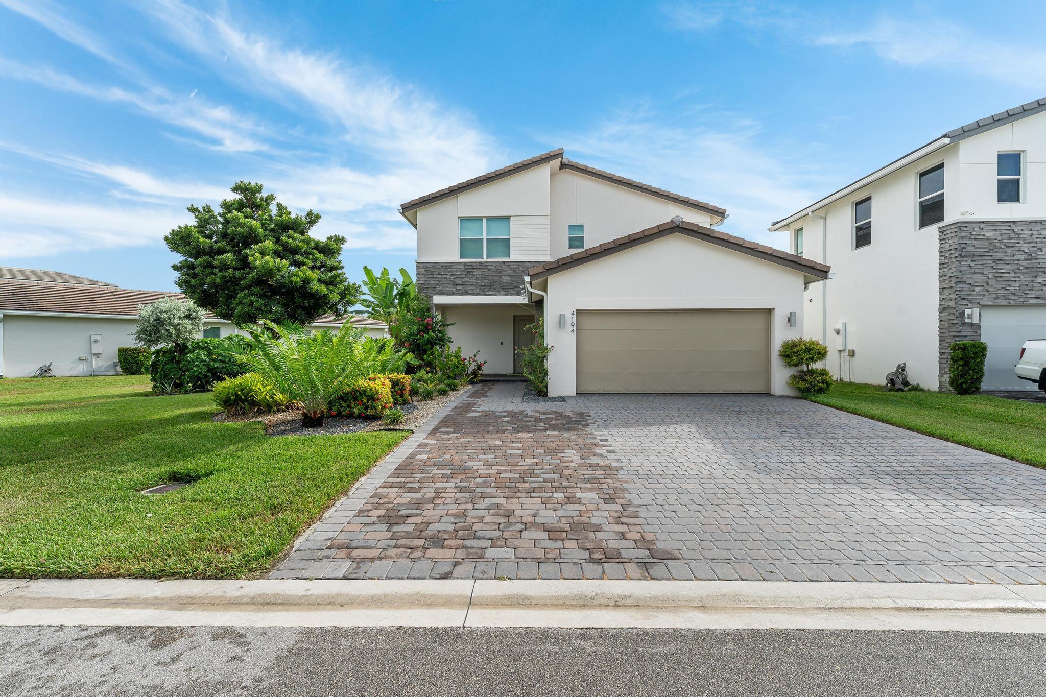 Deluxe Home in Gated, Pet-Friendly Veleiros! Unique Rioja Model is 1 of the rarest & most desirable floorplans on XL Lot. Covered entry opens to foyer & 1st floor bedroom suite, then onto separate dining & great room. Open-plan kitchen w/stainless steel appliances/wall oven+microwave/cooktop+hood, quartz counters+island, pantry & hall to 2-car garage. Covered paver patio opens to sizable yard. Lawnmowing included. Upstairs, master suite spans width of home w/master bath feat. dual sinks & step-in shower + walk-in closet/dressing room. Bright bonus loft perfect for den/home office. Laundry room & 2 more bedrooms + guest bath on 2nd level. Ceramic wood-look tile in living area, LVP in bedrooms, impact windows & sliders, upgraded window treatments/lighting, Smarthome features. Clubhouse/Pool.