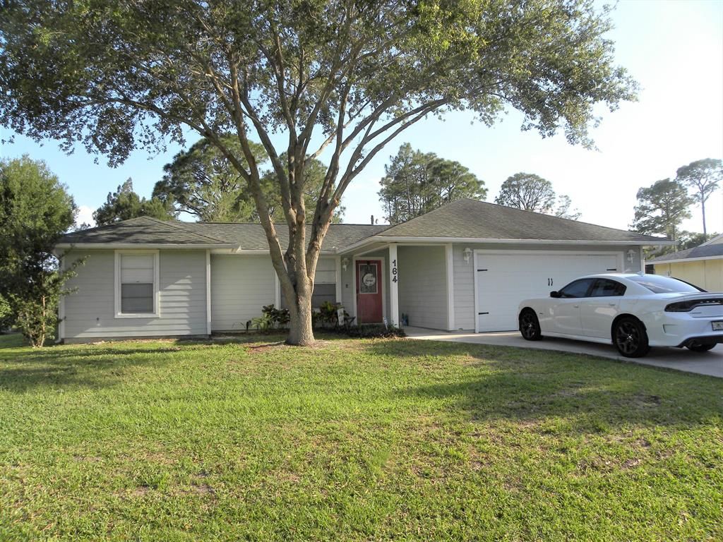 Photo of 164 NE Royce Avenue, Port St Lucie, FL 34983 (MLS # R10887489)