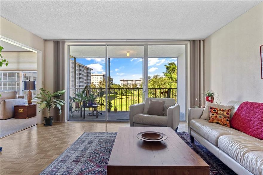 One less neighbor on this TOP FLOOR, END UNIT in a tranquil & charming MID-RISE building. Light, bright & spacious with amazing, sprawling green space & tree top views, and a private screened terrace! Roomy primary suite has an updated bath, huge walk-in closet & another wall of triple closets! Bedroom two is perfect for a visiting guest with another nicely updated & bright second full bath. Third bedroom is opened up to expand the beautiful views and currently has the closet area utilized as a HOME OFFICE SPACE plus a sitting area. Extra storage, laundry and trash chute on same floor near elevators. Community offers clubhouses, pools, sporting, fitness, jogging areas, waterways, amazing landscaping and expansive Golf Courses. Shopping, gaming, beaches and major roadways are all nearby. Three full bedrooms and two full baths.