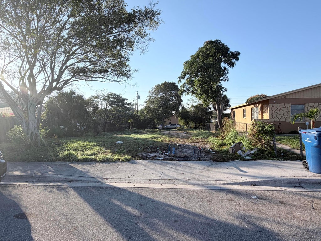 Photo of 1149 W 34th Street, Riviera Beach, FL 33404 (MLS # B26081484)