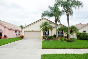 "A real Gem" Pristine condition, light, bright and spacious. Updated to the hilt. This 3 bedroom, 2 bath home features a separate family room in addition to the living & dining rooms. Split bedroom floor plan, fully tiled in all living areas. This freshly painted home features a spacious updated kitchen with granite counter tops, pullouts, new microwave & newer cabinets. Other features include a new roof (2012), remodeled bathrooms, new A/C and condenser (2012), new garage door with hurricane code, new washer/dryer, accordion hurricane shutters and re-landscaping done in 2014. Large screened patio features incredible hot tub. In addition, there is second unscreened tiled patio good for outdoor barbecues or sunbathing. Lovely private backyard.
