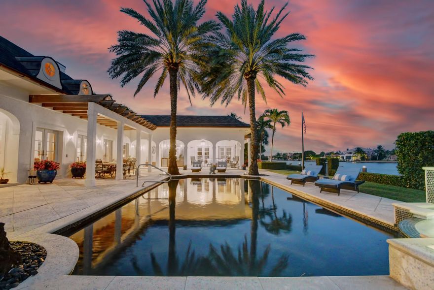 Beautiful Estate Home located on a Large Waterfront Lot in Point Manalapan. Sitting on 31,500sft /0.723 Acres,this 4 Bedroom ,4 Full Bathroom, 2 Half Bathroom Property has 210ft frontage and 150ft depth. Fine finishes and Upgrades Include: Tumbled Stone Floors, Pecky Cypress wood, 2 stunning FIreplaces, Imported Glass Tile, Solid Wood Cabinetry , Hurricane Impact Windows , Summer kitchen , A Magnificent Heated Pool with Waterfall ,A quaint Garden off of the Dining room , An In-Law Suite with Separate entrance, A Renovated 80ft Dock with Ocean access. No fixed Bridges. 24 hour Guarded Gate House.Enjoy Gratis Membership to La Coquille Club at EAU Resort . Manalapan is truly South Florida Living at its Best .*Watch Video to capture this Home's beauty.