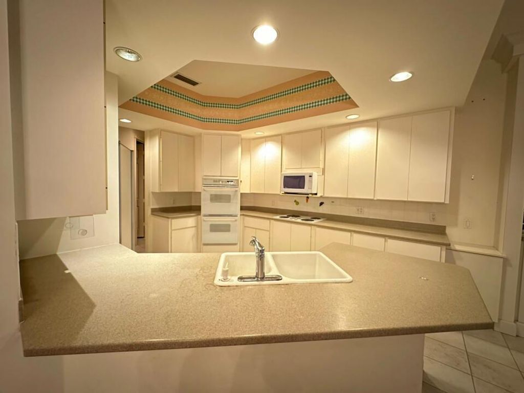 Photo of 1633 Flagler Manor Circle, West Palm Beach, FL 33411 (MLS # R10944557)