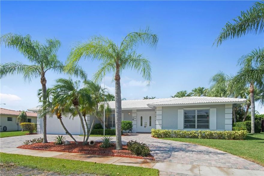 This lovely 3 Bed/2.5 Bath Home is remarkable!  Freshly Painted exterior, newer roof + paver circular driveway.  Remodeled Kitchen, Master Bath + half bath + Newer AC. Beautiful New French doors open to the covered sitting area, remodeled patio and pool on Oversized gorgeous lot with professional landscape. Such a peaceful Oasis! The screened in pool area is huge and a great entertaining area for family fun! This spacious light and Bright One story home has large 2 car garage and storm shutters.