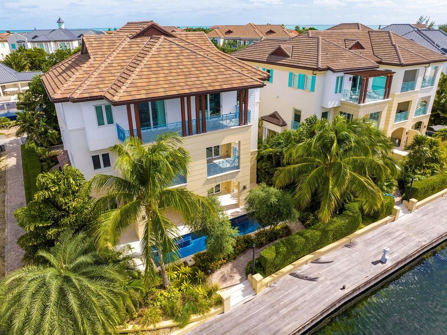 SOLD at Luxury AUCTION Without Reserve on Mar 7, 2024! List price for REFERENCE ONLY. Located in The Residences of Stone Island, a premier waterfront enclave on Grand Cayman, adjacent to the Cayman Islands Yacht Club and a short walk from Seven Mile Beach. Three living levels span 9,500 total sf, with 5 beds & 8.5 baths. Features include a gourmet kitchen, elevator, home theater, office, 2 garages and a pool with loggia and summer kitchen. Completed in 2020, never occupied and impeccably maintained. Conveys with $750,000 of unused furnishings included! Community amenities include gated entry, 24-hr security, private boat slips, waterfront boardwalk, playground, infinity pool and posh owners’ clubhouse.