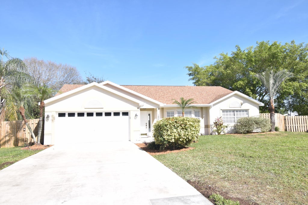 Photo of 1801 SW Grant Avenue, Port Saint Lucie, FL 34953 (MLS # R10956183)