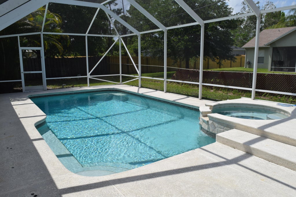 Photo of 1801 SW Grant Avenue, Port Saint Lucie, FL 34953 (MLS # R10956183)