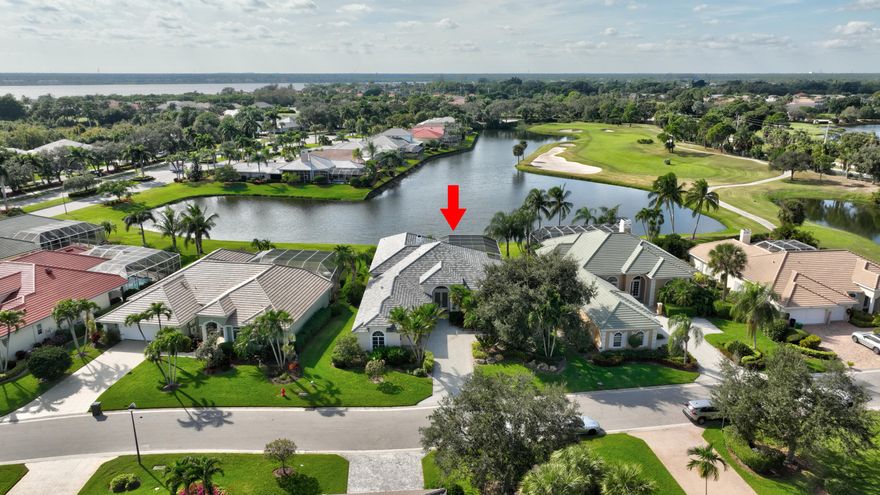 NEW PRICE! Water and golf course views with stunning sunsets and a 67-slip marina await in the prestigious, gated Ballantrae community. This spacious 3,350 sq ft pool home offers 3 bedrooms plus a dedicated office, 3 full and 2 half baths, a NEW ROOF, and two  newer A/C units.  Enjoy resort-style living along the St. Lucie River with access to a private golf course, yacht club, and numerous amenities. The open kitchen and living area flows to a screened pool and spa overlooking wide water views, while 12-foot ceilings, crown molding, and a fireplace add elegance throughout.  The primary suite features two large walk-in closets and a luxurious jacuzzi tub, while each guest bedroom has its own ensuite bath. A dedicated office offers the perfect work-from-home​​‌​​​​‌​‌​​​‌‌​​​‌‌‌​​‌​​‌‌​​​​ space.