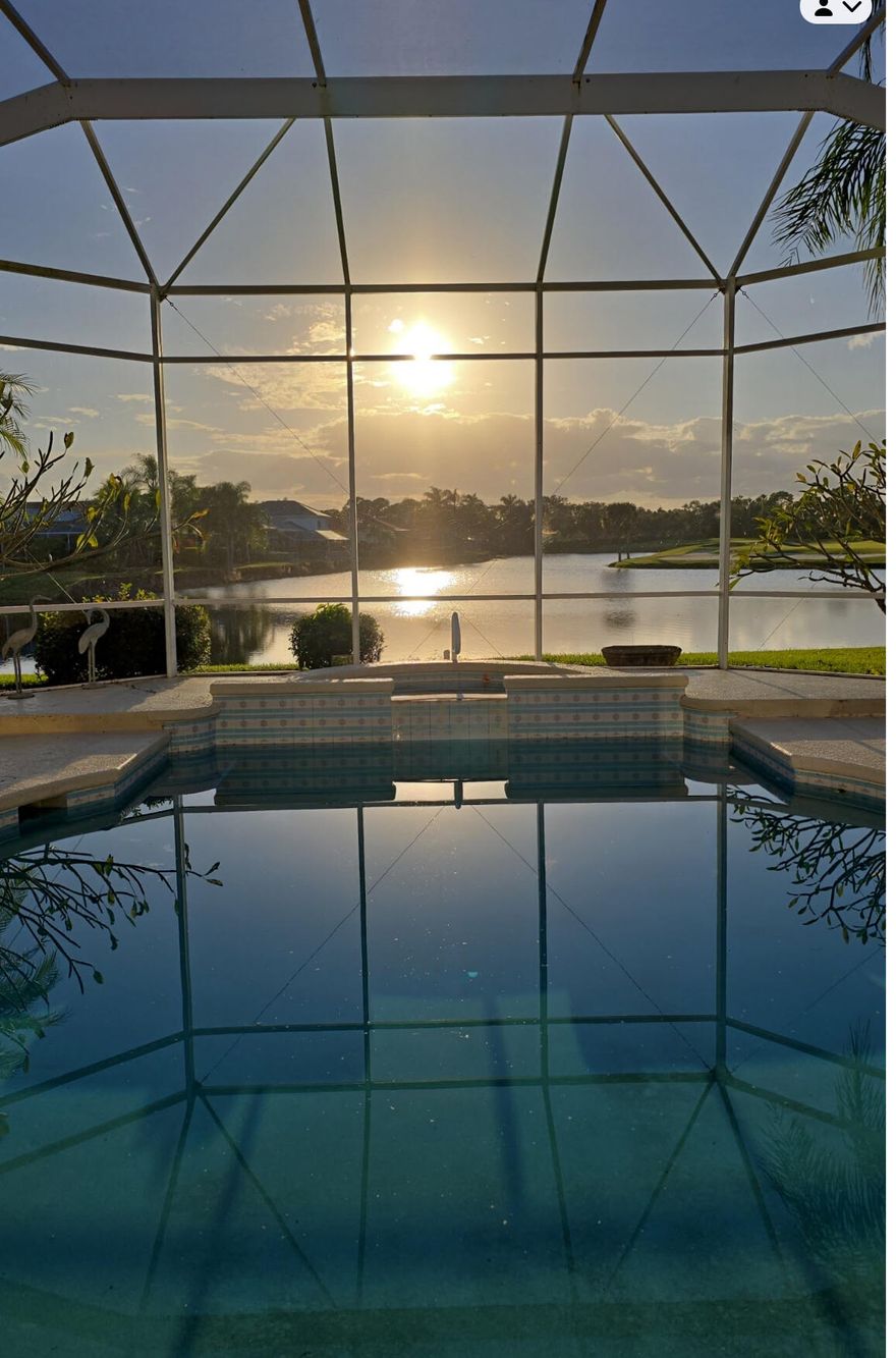 NEW PRICE! OPEN HOUSE 3/7 12-2. Water and golf course views with stunning sunsets and a 67-slip marina await in the prestigious, gated Ballantrae community. This spacious 3,350 sq ft pool home offers 3 bedrooms plus a dedicated office, 3 full and 2 half baths, a NEW ROOF, and two  newer A/C units.

Enjoy resort-style living along the St. Lucie River with access to a private golf course, yacht club, and numerous amenities. The open kitchen and living area flows to a screened pool and spa overlooking wide water views, while 12-foot ceilings, crown molding, and a fireplace add elegance throughout.

The primary suite features two large walk-in closets and a luxurious jacuzzi tub, while each guest bedroom has its own ensuite bath. A dedicated office offers the perfect work-from-home​​‌​​​​‌​‌​​​‌‌​​​‌‌‌​​‌​​‌‌​​​​ space.