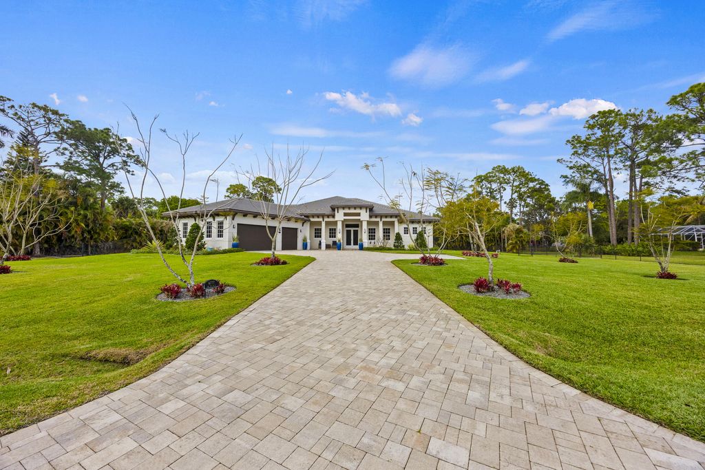 Photo of 6777 140th Lane N, Palm Beach Gardens, FL 33418 (MLS # R11170009)