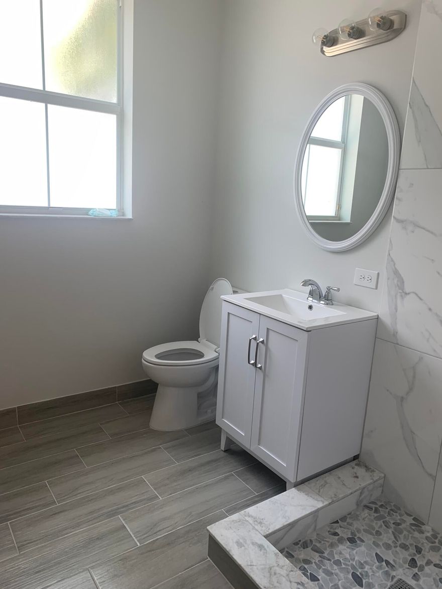 Immaculate townhouse in the heart of Boynton Beach. This home has a full bedroom downstairs with beautifully refinished stairs that lead up to the open kitchen with living/dining area and full bed and bath. The third floor has an additional two bedrooms with two ensuite baths. The entire second and third floors have newly installed vinyl flooring and a brand new dishwasher in the open kitchen. This house has central vacuum and many hi hats, in addition to the natural light that streams through the home. Three of the four bathrooms have brand new vanities and seamless glass enclosures. The bathroom on the main floor has brand new installed shower tile as well. The AC is less than five years old and the whole house has been freshly painted. This community has it all and centrally located