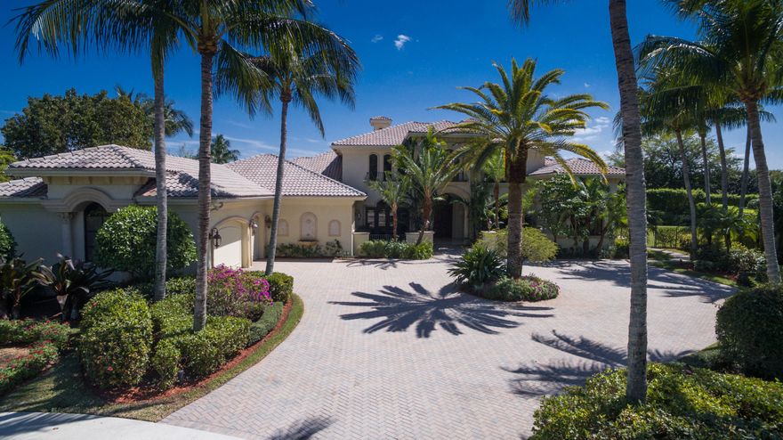 The exceptional custom one story four BR Mediterranean residence offers extreme privacy in a world class Polo Country Club community.  Located on a one-half acre south exposure quite cut-de-sac street, an oversized circular drive showcases a dramatic 24-foot multi-cast stone columned exterior entry.  A stately 24-foot interior foyer showcases a grand living room and full entertainment bar and views of the pool, patio and tropically landscaped property.  A master suite wing consists of the master bedroom, two bathrooms, sitting area and an en-suite office.  A 20-foot library, a billiards room, theater, formal dining room, kitchen-breakfast-family room, and additional single bedroom and double bedroom wings reflect complete grandeur.  A Polo Club Membership is required of Buyers at closing. Property Details and Amenities:

Additional Measurements of other rooms:
Library 22 x 14
Billiards Area 22 x 17
Breakfast Area 11 x 11
Media Room 20 x 16

Classic Mediterranean style home accented with cast stone columns that support arched walkways.  Library has custom hardwood built-ins accented with wrought iron. Master suite has a sitting area and an in suite office with separate His and Hers bathroom area and His and Hers walk-in closets which all access the pool patio area.  

A dramatic 2 story library has an elevator for the purposes of servicing the 2nd story of the library.   

The floors throughout are neutral marble with decorative accents.   Bathroom and kitchen countertops throughout are granite and marble. 
The Grand living room with 20 foot ceilings features a fireplace that has cast stone mantling to the ceiling.  A granite top and rich hardwood entertainment center bar services the dining room, the family room and the living room.  The billiards area has exquisite dark wood paneling, cabinetry and molding throughout.  
The grand entertaining living room has extensive floor to ceiling glass, where the ceilings go to 19 feet high.  The living room entertainment service bar has black granite countertops, enriched hardwood custom cabinetry.  The living room has decorative ceiling detail with dropped box soffits and the entrance foyer.  The soaring and dramatic exterior and interior foyer ceilings are 24 feet high, giving a very regal and dramatic feeling to the house. The home has storm shutters throughout.  There is a stately powder room off of the dining room with custom hardwood cabinetry and black granite countertops.
All bedrooms are suites. The private theater comfortably seats 8.   
The kitchen has granite countertops, hardwood cabinety, dishwasher, double oven, a 6 burner gas grill, microwave and separate sub-zero refrigerator and freezer with multiple refrigerator and freezer drawers.  
Family room features a custom crafted hardwood cabinetry built-in in the family room.
Extensive ceiling detailing throughout
There is a full bathroom off of the family room that also serves as a full cabana bath. All of the bedrooms have walk-in closets and all bedrooms have high ceilings
 Storm roll down panels in addition to accordion panels throughout.  
20x20 covered and screen enclosed patio has a bar area and gas BBQ
opens to an oversized paver patio and 40x20 foot pool with rock waterfall and heated spa.  
Electric and solar pool heaters, in addition to Solar panels.  
A propane generator and buried propane gas tank are also amenities.