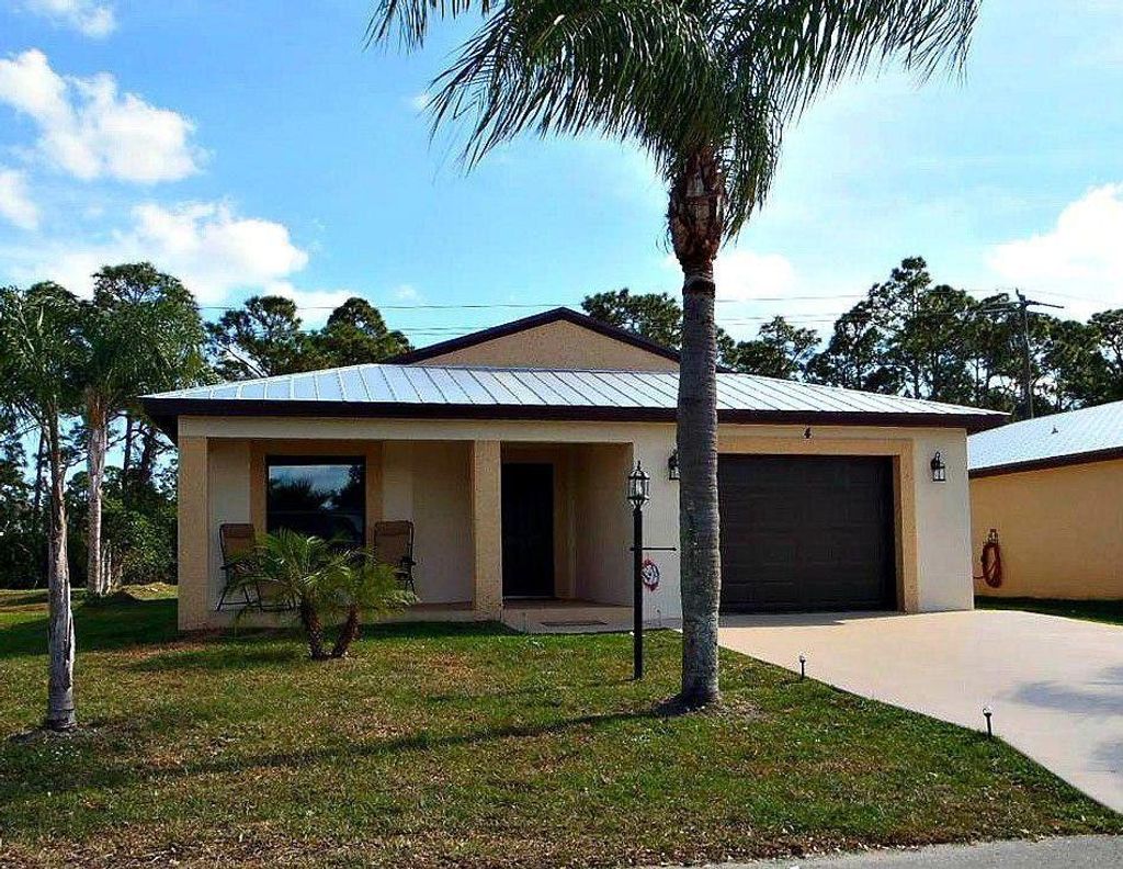 Photo of 6 San Juan Lane, Port Saint Lucie, FL 34952 (MLS # R10738264)