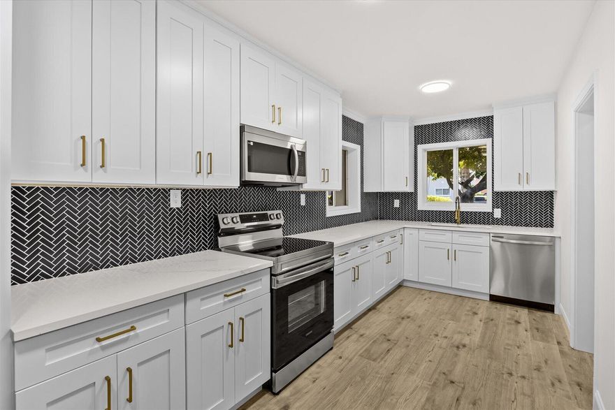 Showings must be scheduled with Showingtime. Exquisite 3-bedroom, 2-bathroom Pool residence, fully renovated. The gourmet kitchen boasts luminous Calacatta quartz countertops, bespoke soft-close shaker cabinetry, and premium high-end finishes, designed to inspire culinary excellence. Luxurious spa-inspired bathrooms feature sophisticated tile work, free standing tub, gorgeous vanities, and contemporary fixtures, elevating daily rituals to a serene escape. Impeccable waterproof laminate flooring, freshly painted interiors and exteriors, and brand-new, top-tier appliances blend style with functionality. Enjoy effortless access to I-95, premier shopping, and dining, with the freedom of no HOA restrictions. This residence seamlessly blends modern luxury with timeless comfort.