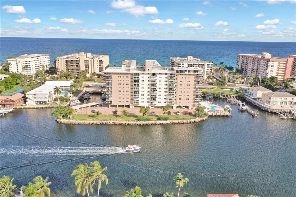 Enjoy breathtaking Sunrises & Sunsets every day of the week from this spacious 2 bed/2 bath condo. Incredible Ocean & Direct Intracoastal views from the 9th Floor of this condo. Beautiful Kitchen equipped w/ SS appliances, granite counters and island. Gorgeous porcelain tile throughout the kitchen and main living area. Built in cabinetry in the living room w/ a built-in bar, wine cooler and desk, great for entertaining. 2 en-suites w/walk in closets. Hurricane Windows/ Sliders. Large Balcony w/amazing intracoastal views. Enjoy the heated pool, small gym, community room and gated Ocean/Beach Access. Covered parking. When Available, on-site Boat Dockage up to 42 ft. Building Certification & Reserve Study complete. Building project is near completion by May 2025 & assessment is paid in full.