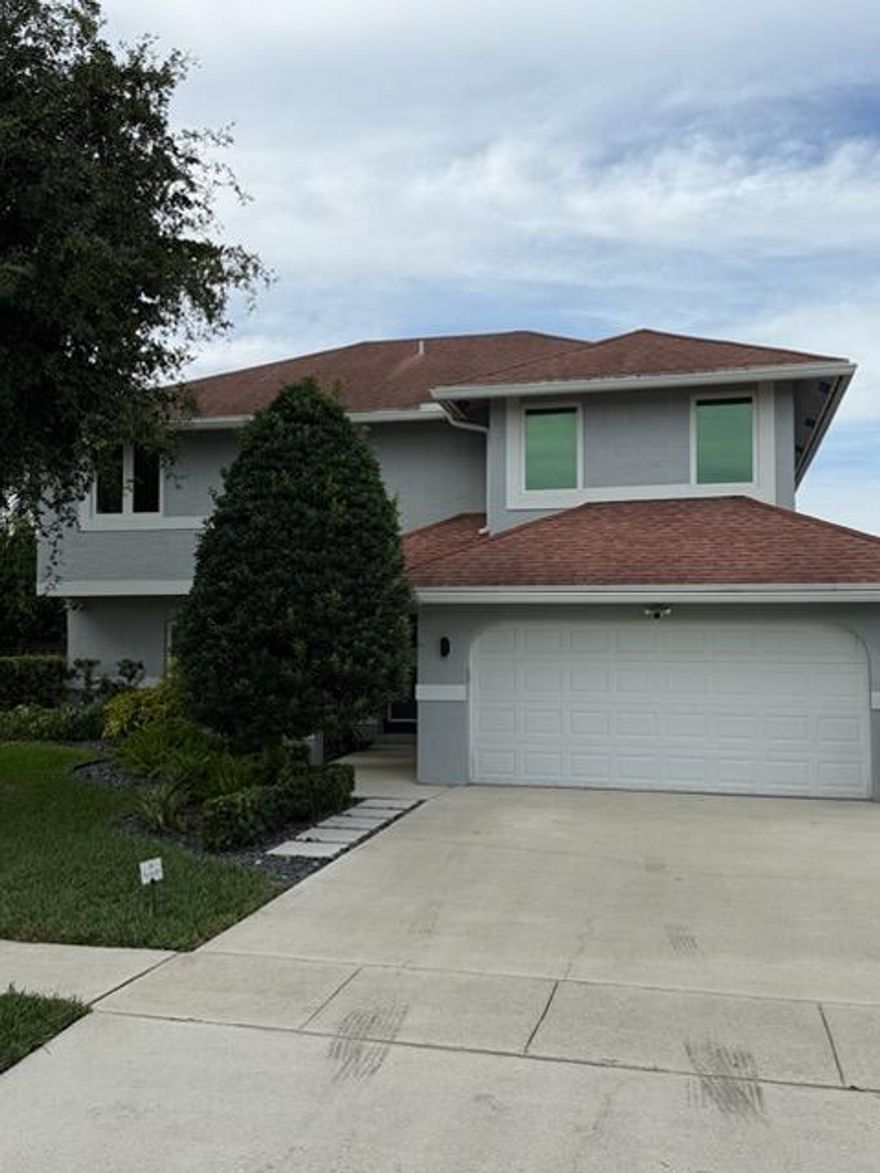 Beautiful corner 4-bedroom, 2.5-bath, two-story home in Ashley Park. This spacious property features a bright family room, dining room, and a functional layout. Enjoy a private fenced yard with updated landscaping, screened patio and porch, and a heated, salt-chlorinated pool. All windows and doors are upgraded to impact. Additional upgrades include an EV charging outlet in the garage, CAT6A network wiring, whole-home water filter and softener, Trex fencing, and remediated polybutylene piping. Conveniently located near top schools, parks, shopping, and dining.