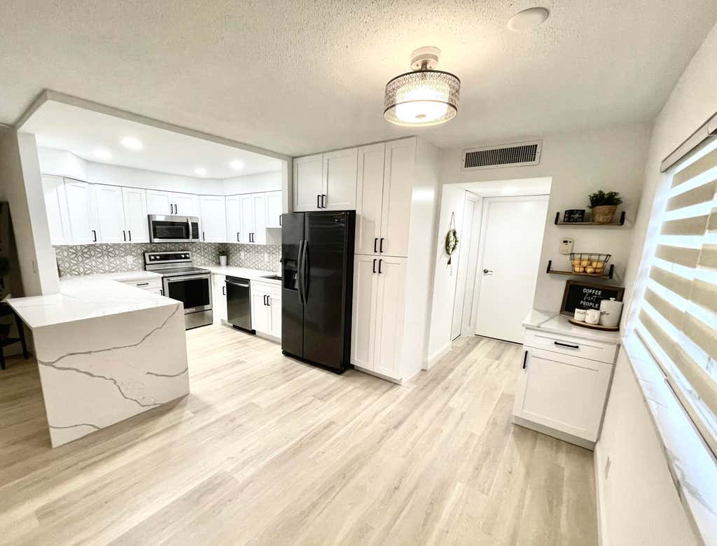 Photo of 62 Monaco Court Ct #B, Delray Beach, FL 33446 (MLS # R10809563)