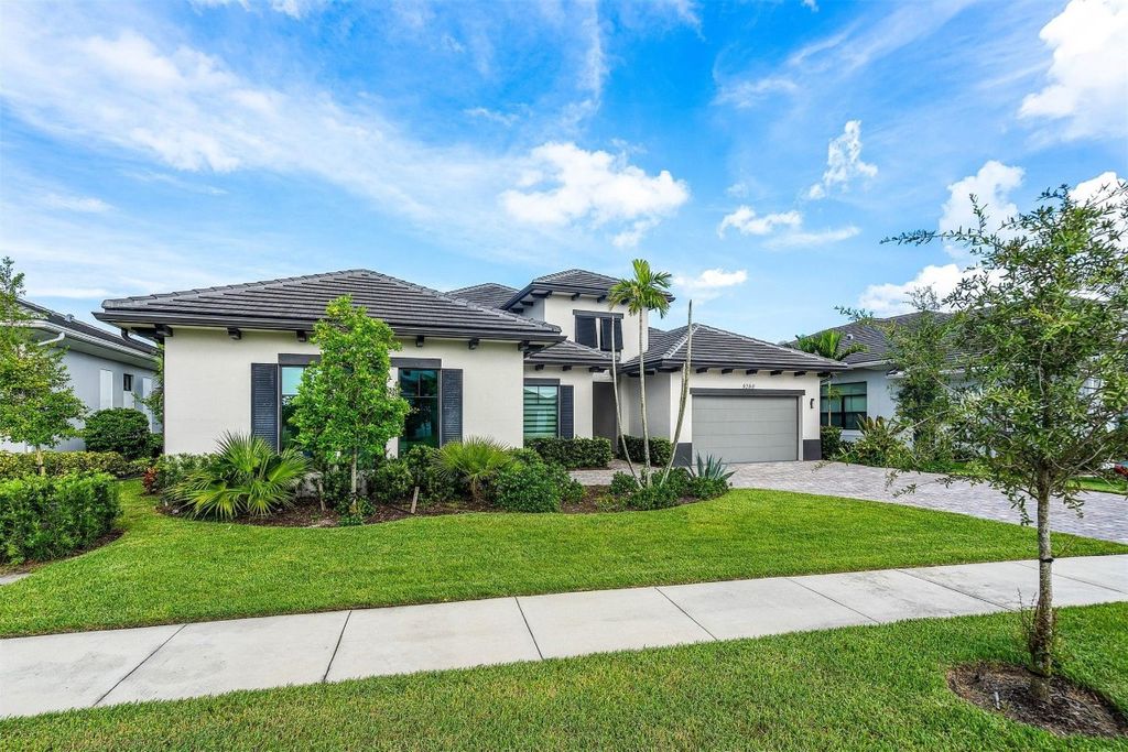 Photo of 9280 Coral Isles Circle, Palm Beach Gardens, FL 33412 (MLS # F10506976)