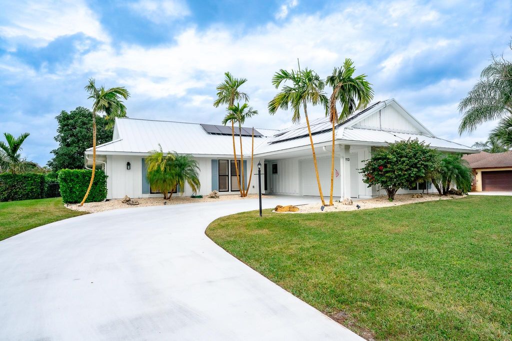 Photo of 113 SE Turtle Creek Drive, Jupiter, FL 33469 (MLS # R10950877)